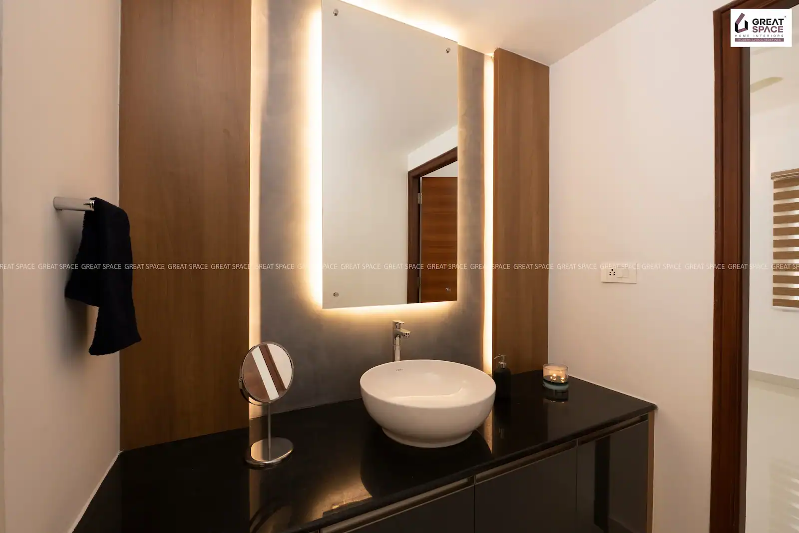 Vanity area with dark counter, round wash basin and mirror lighting, Vyttila apartment